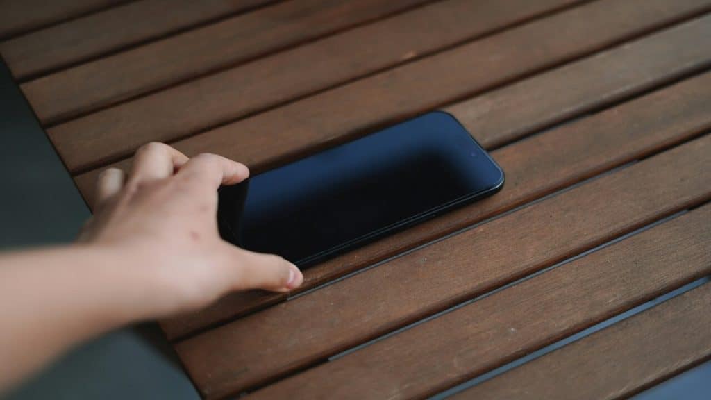 A person putting their phone down