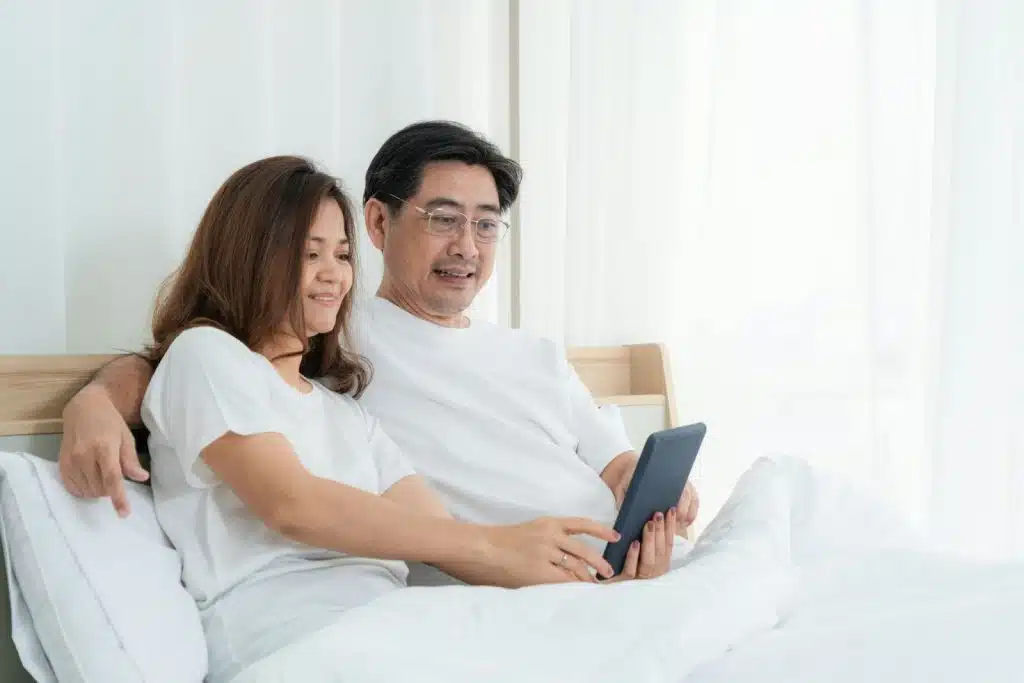 A man and woman at the bed 