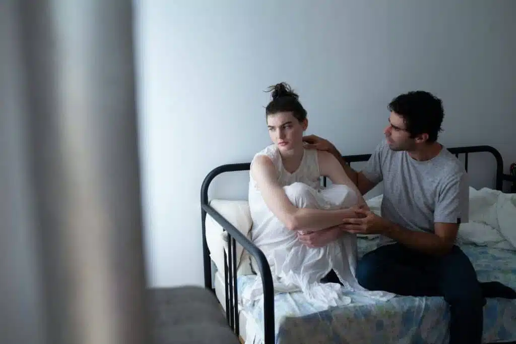 A man approaching a woman