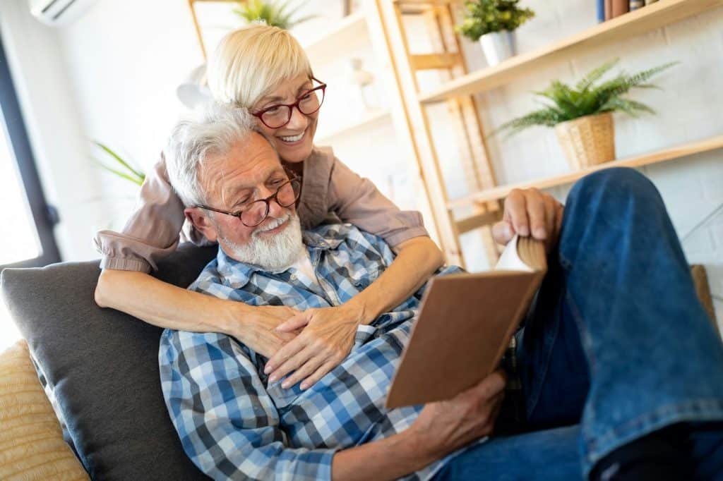 A woman hugging a man