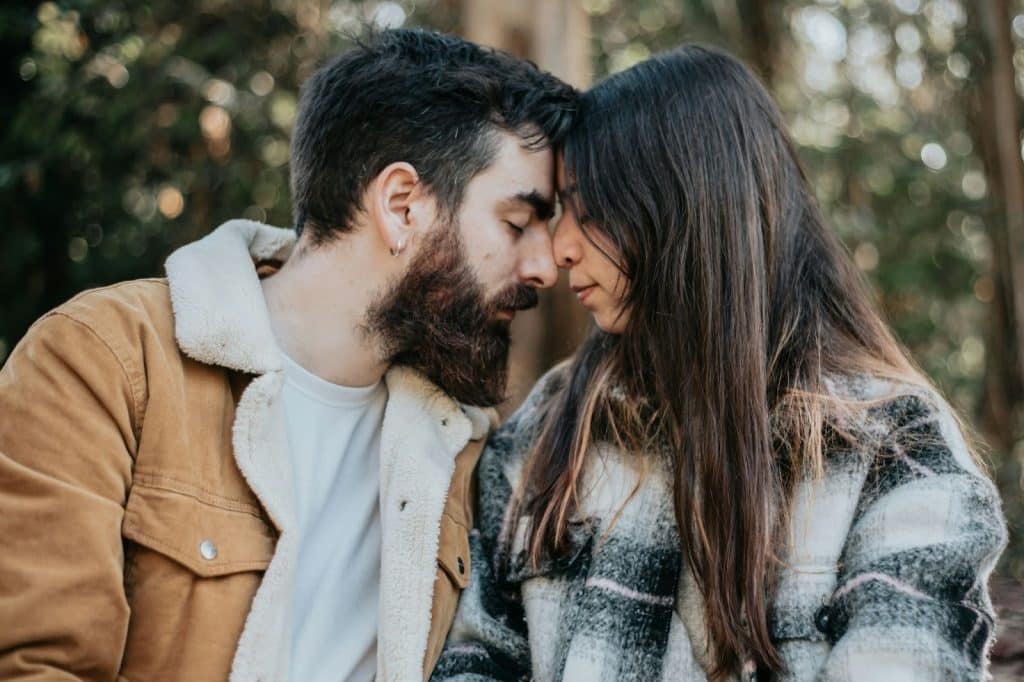 A man and woman facing each other