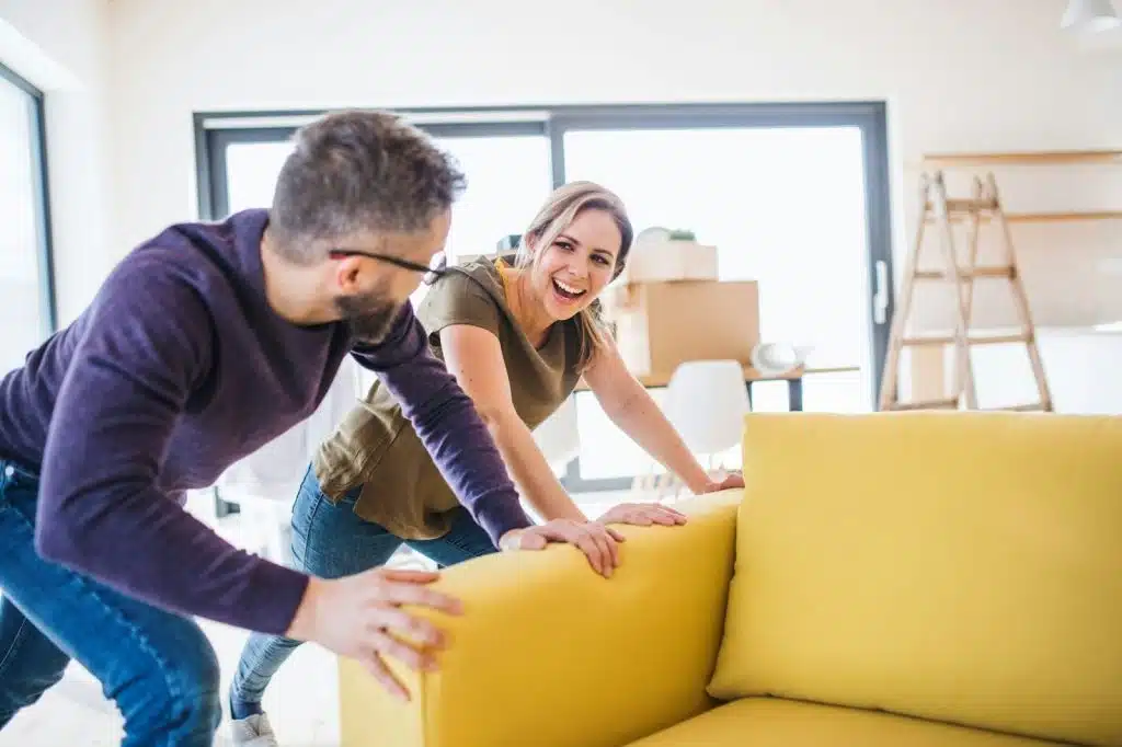 A man and woman cleaning home