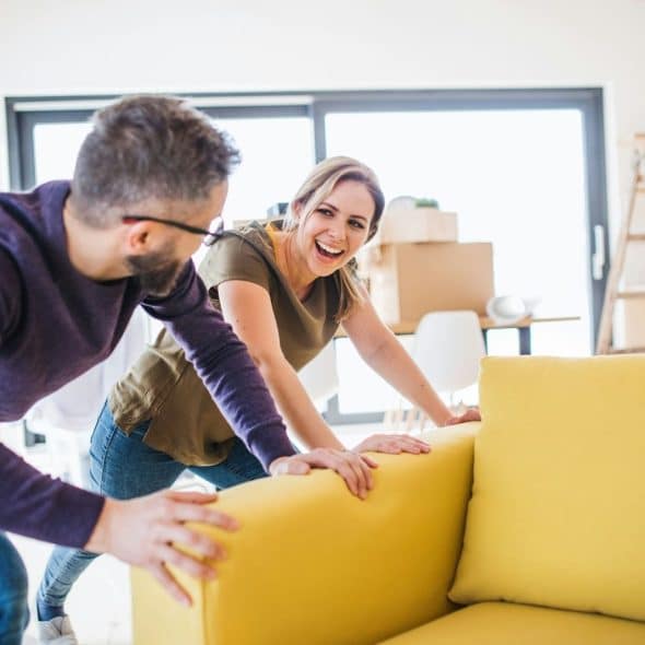 A man and woman cleaning home