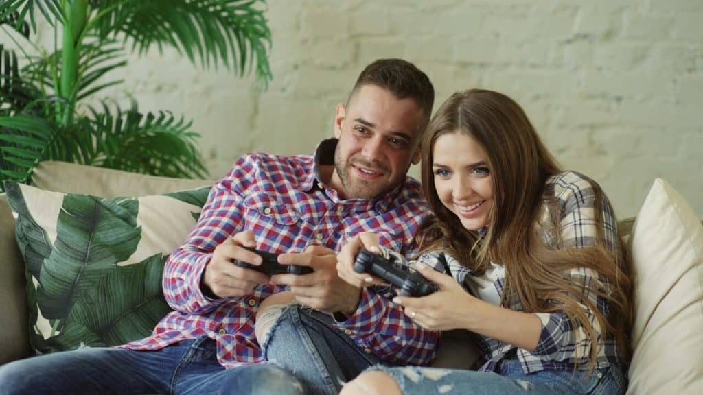A couple playing a video game together