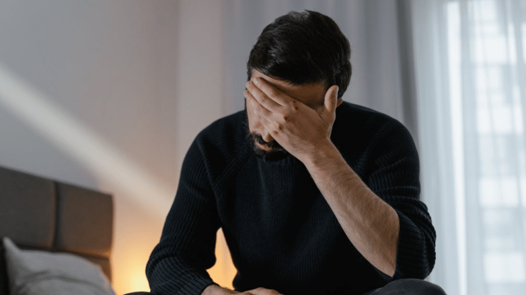 A man looking sad at home