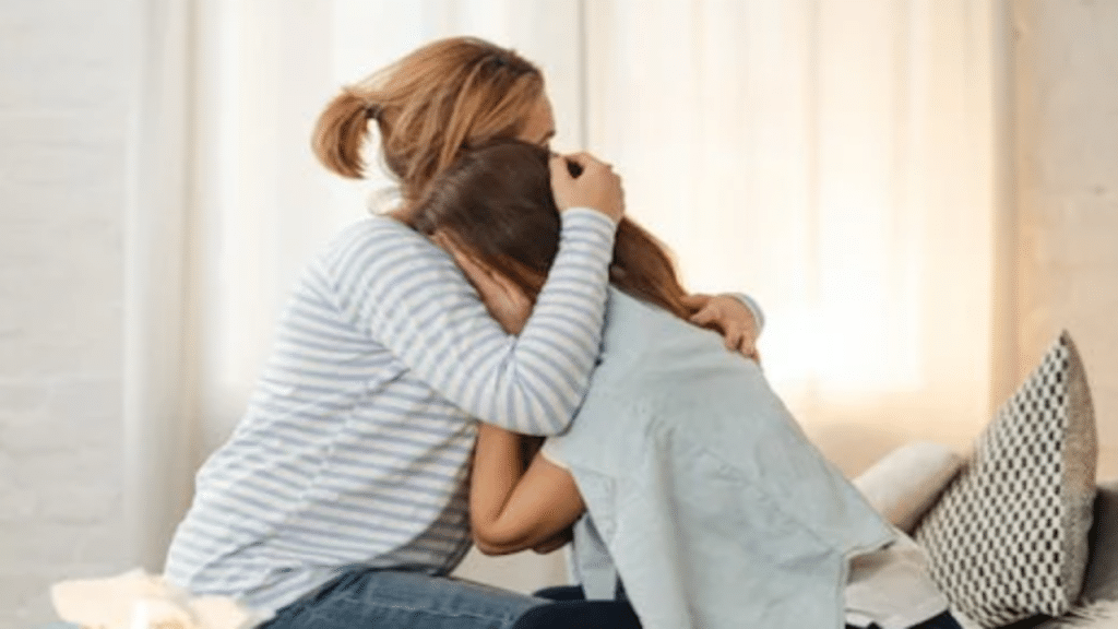 A woman comforting her friend