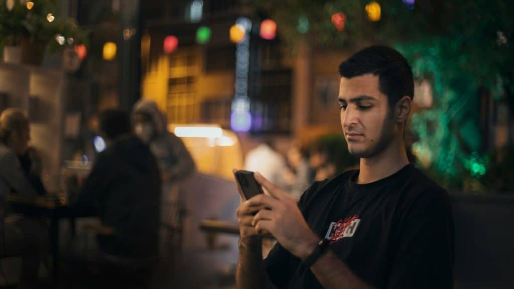 A man using his phone during a date