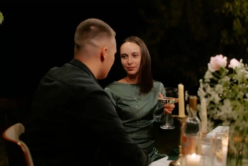 A man and woman looking at each other 