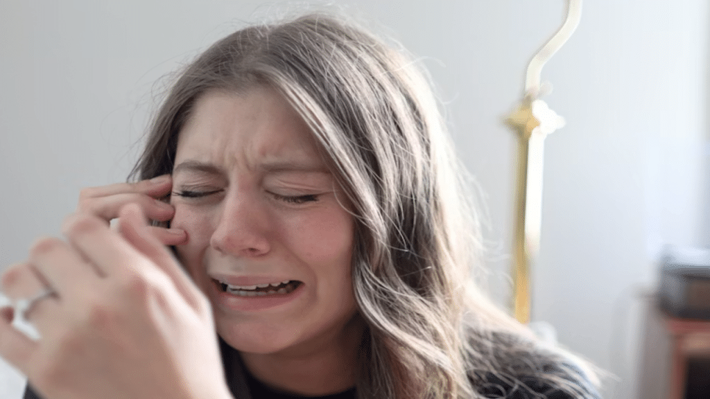 A woman crying at home