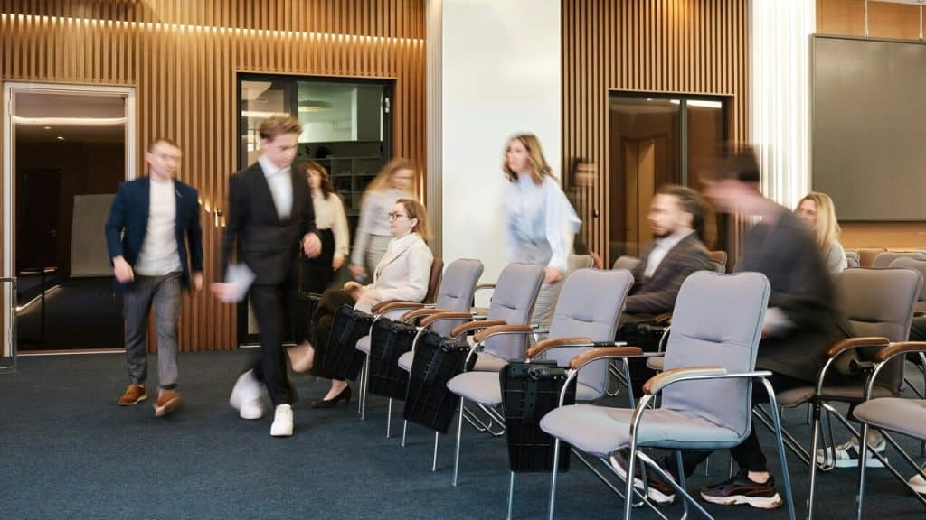 People entering a conference room