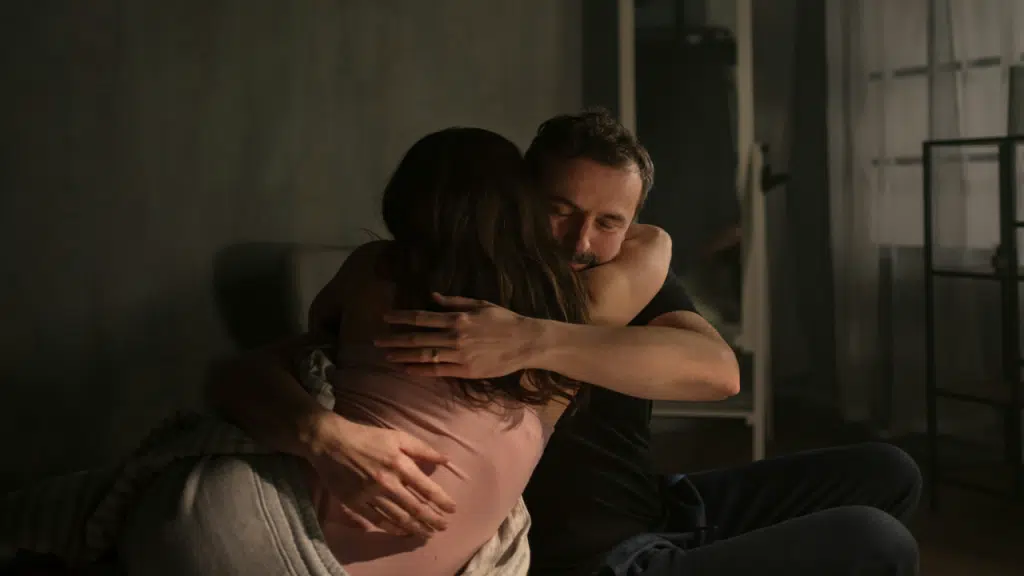 A couple giving each other a hug