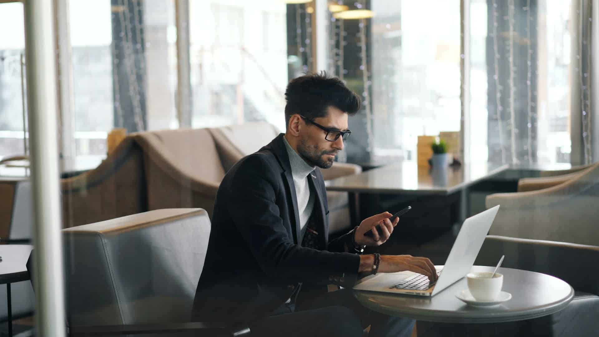 A man using a laptop.