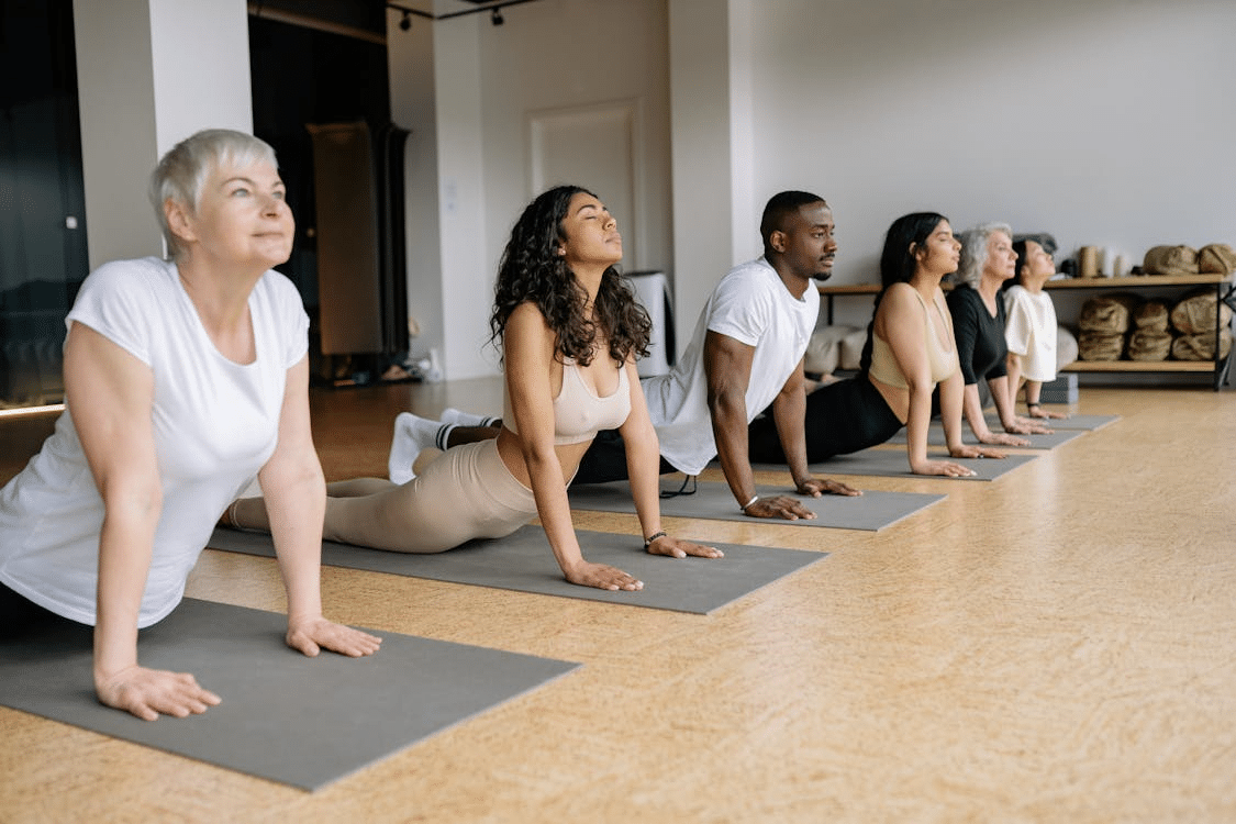 Several people doing yoga