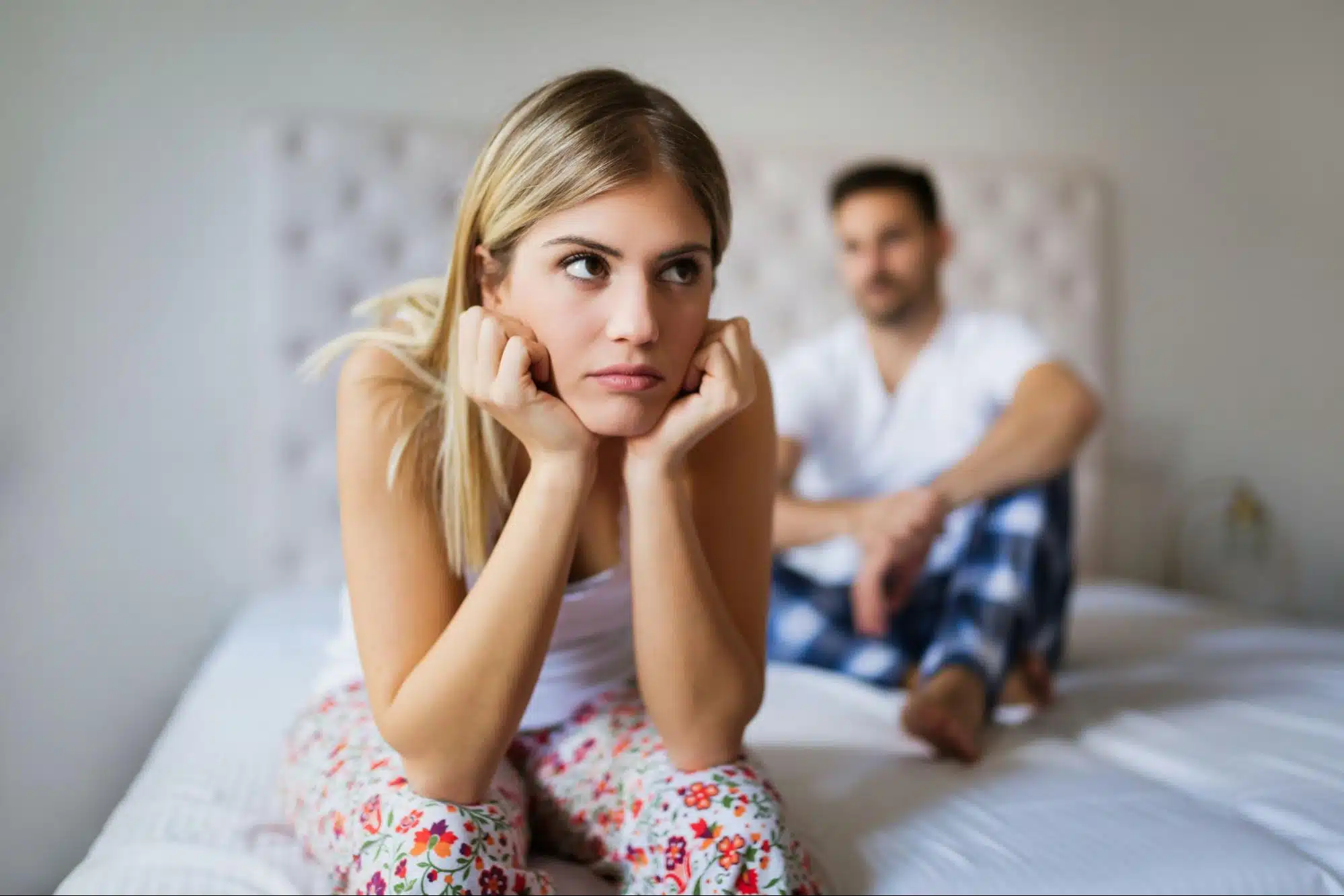 A woman keeping a distance from her boyfriend 