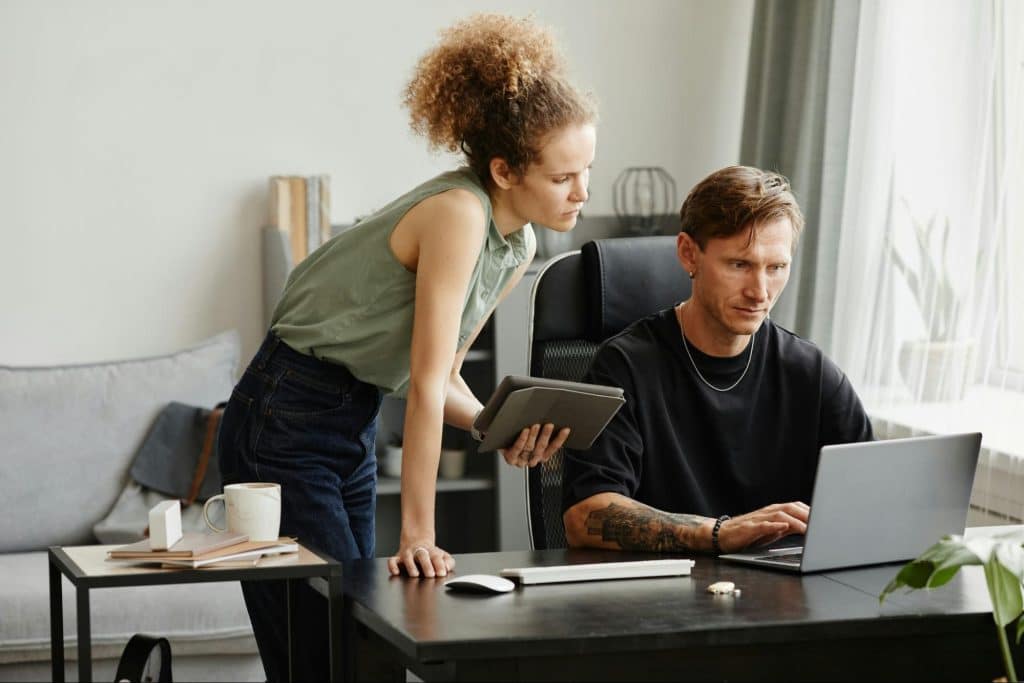 A man and woman looking serious