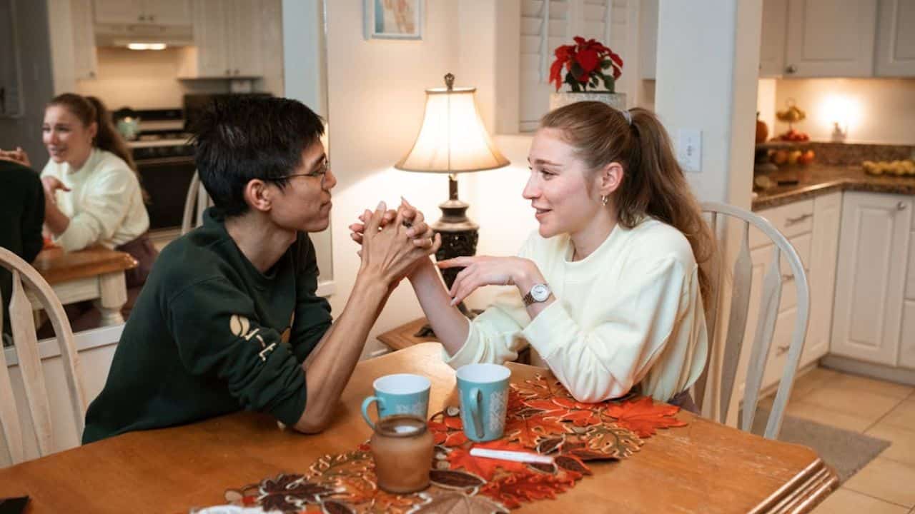 Couple holding hands after an honest conversation