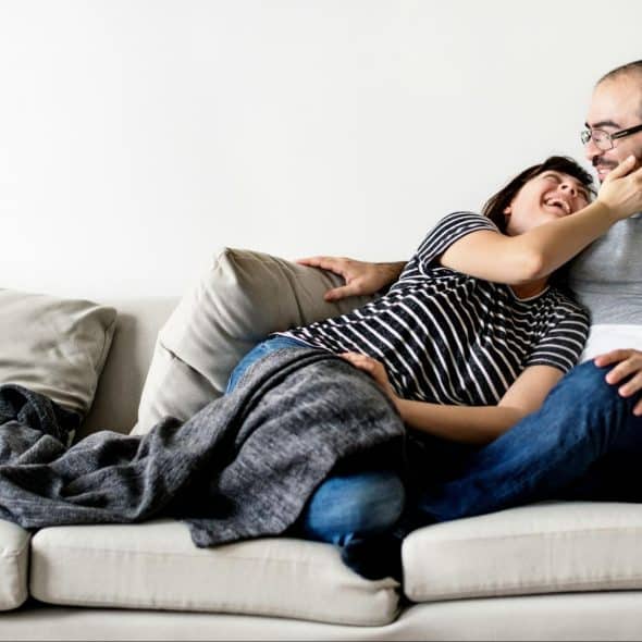 A man and woman at the couch