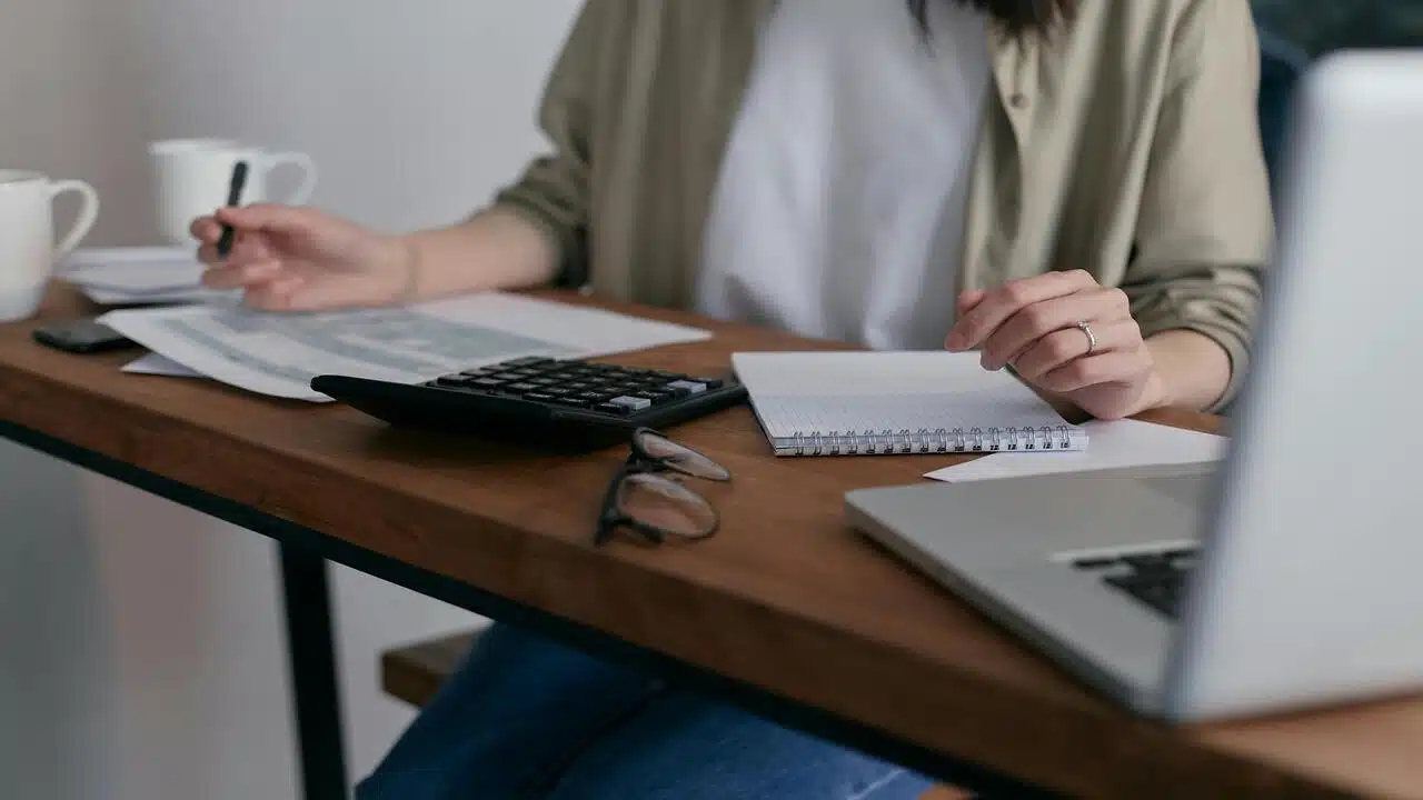 A woman working on her bills