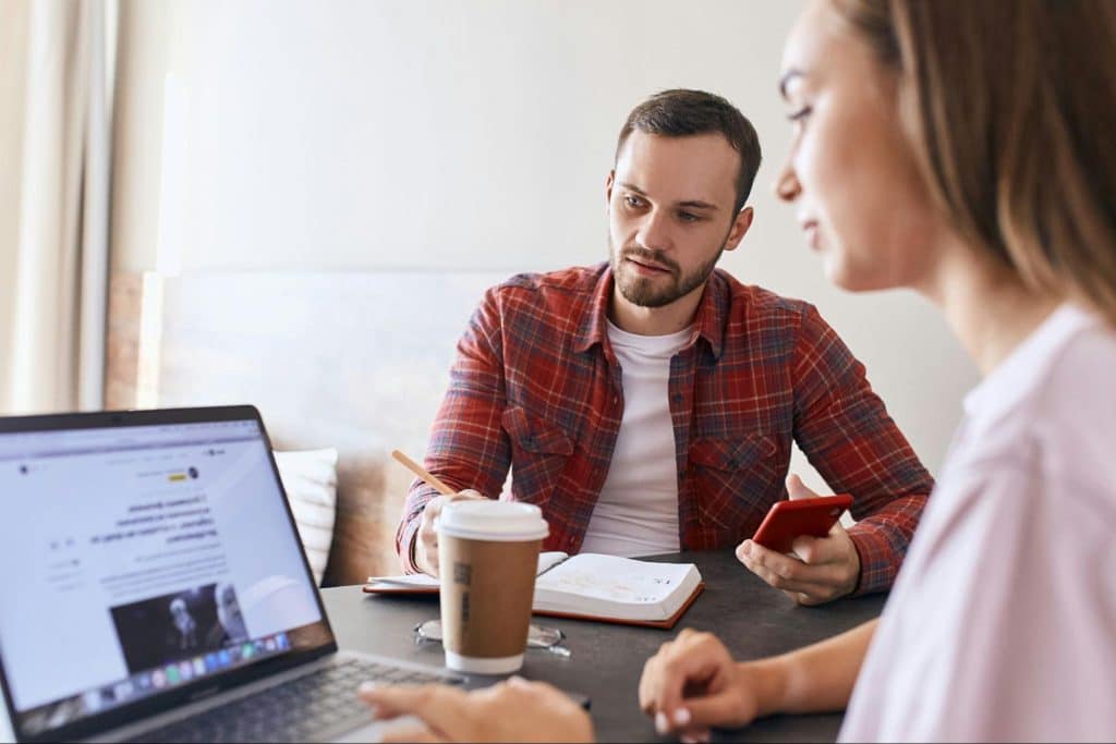 A man just looking at the woman’s activity