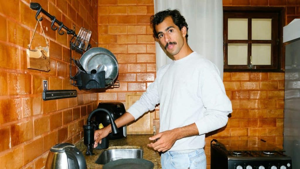 A man cleaning the kitchen.