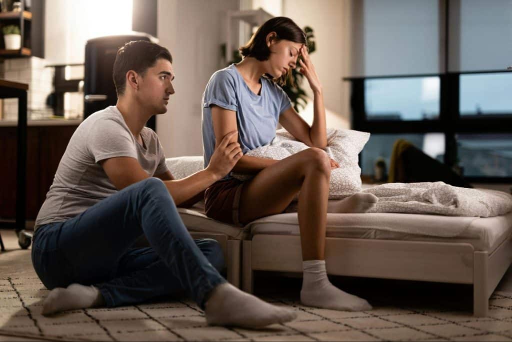 A man apologizing to a woman