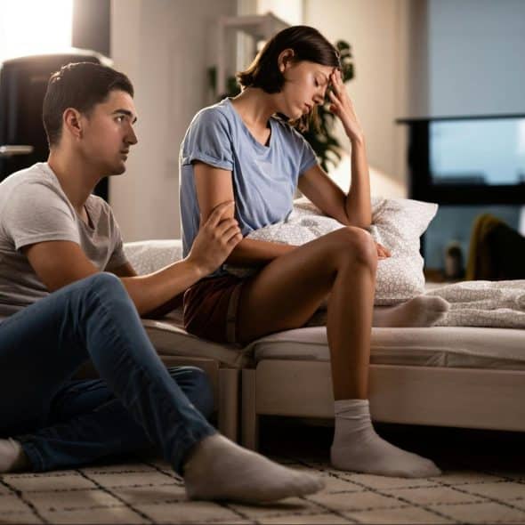 A man apologizing to a woman