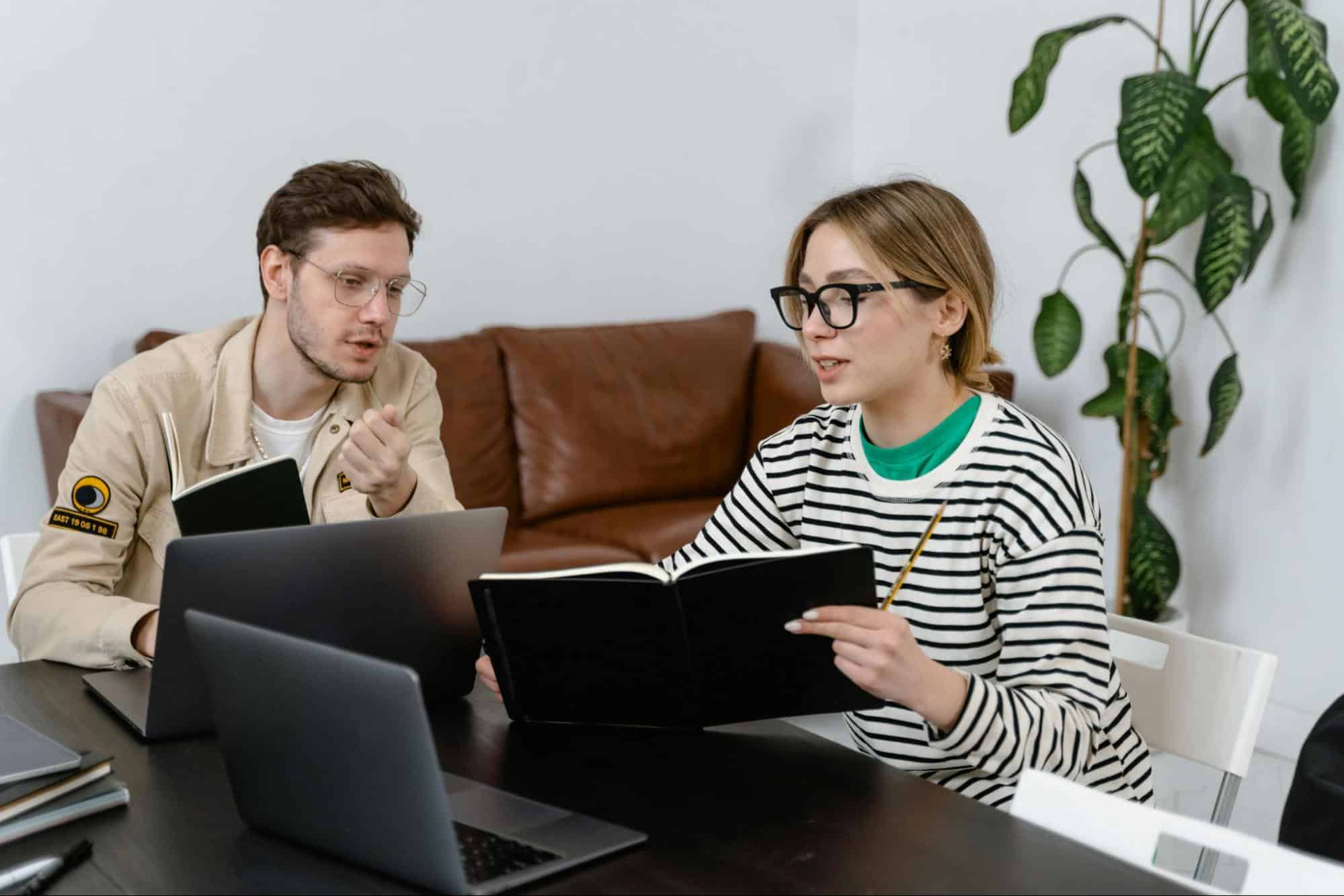 A man explaining something to woman