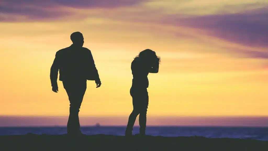 A couple fighting at sunset