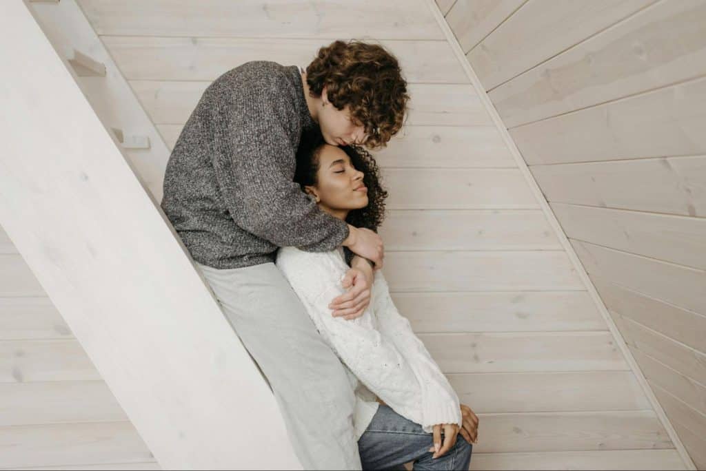 A man hugging a woman