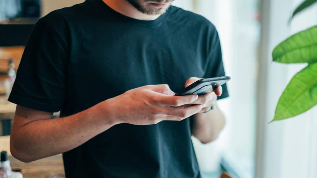 A man texting at home