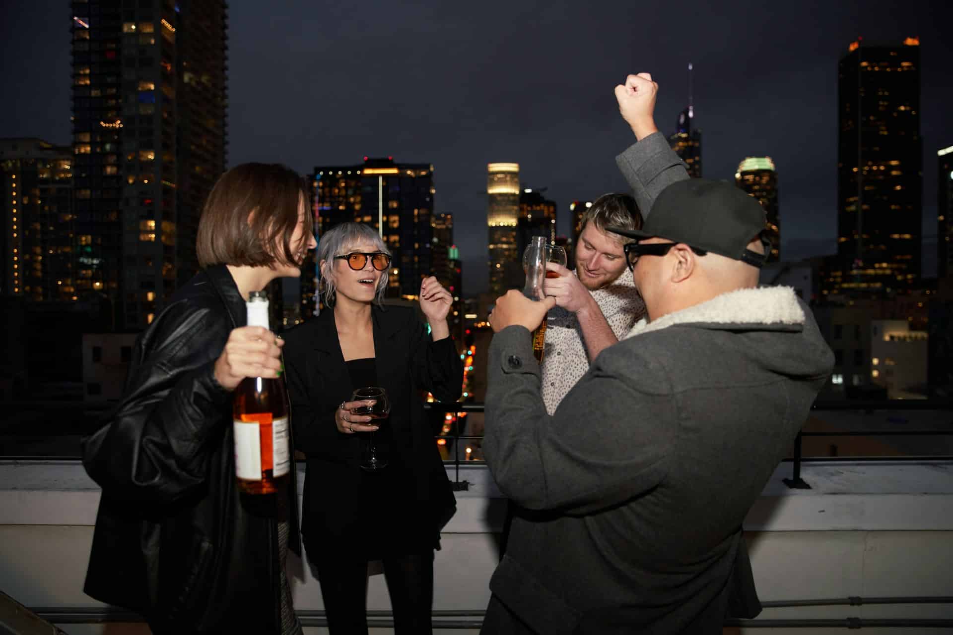 Friends partying at a rooftop bar.