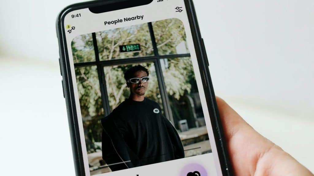 A person’s profile on a dating app shown on a smartphone