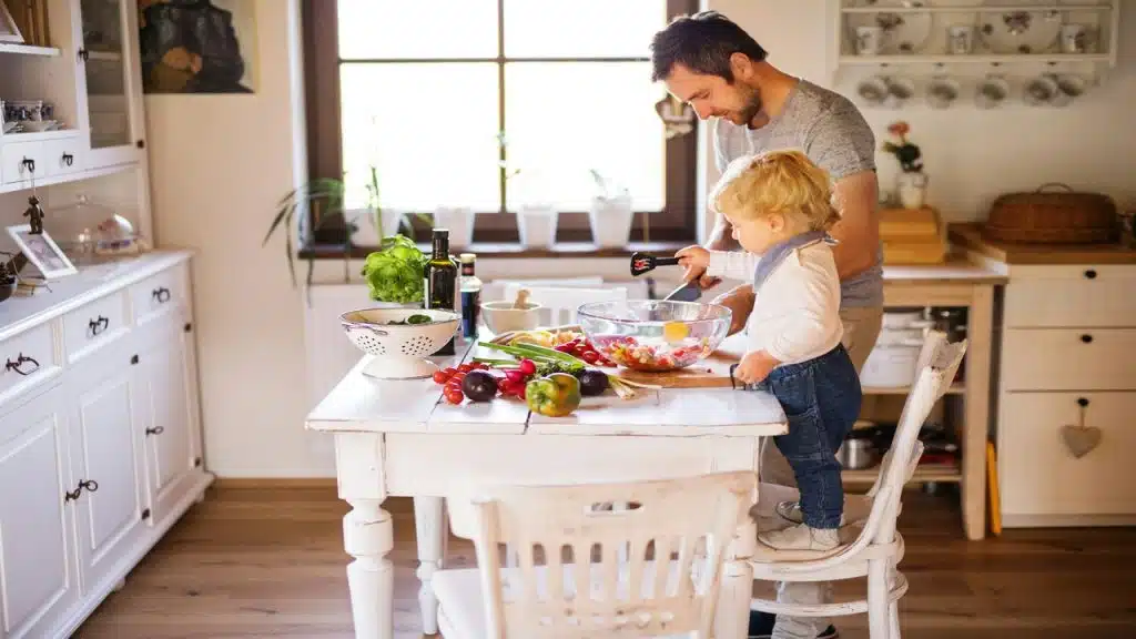 A man cooking with his kid