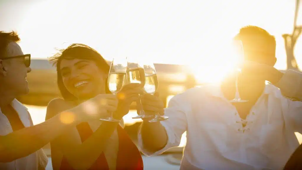 A group of friends having champagne on a yacht