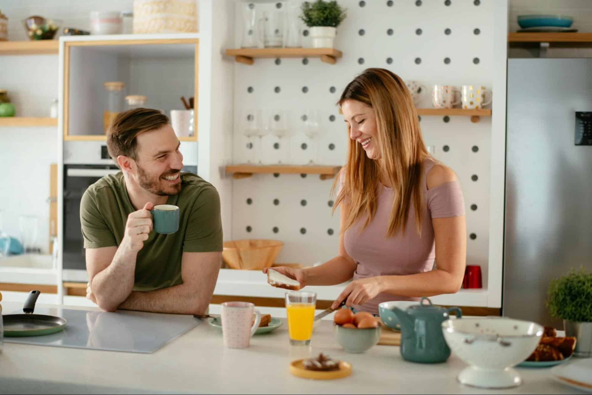 A man and woman at the kitchen 