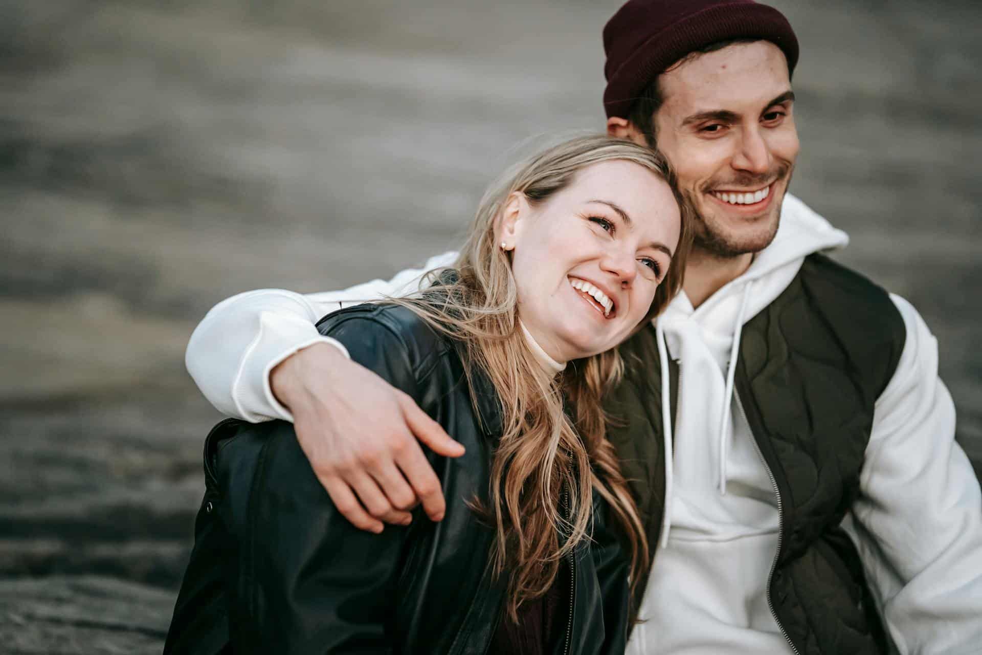 A man embracing his girlfriend.