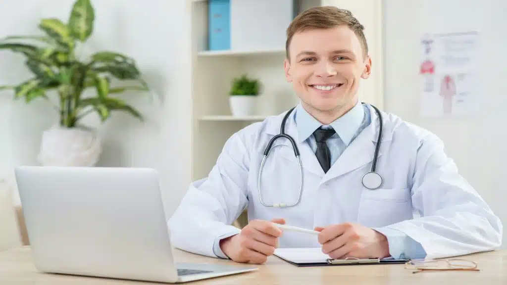 A doctor smiling at the camera