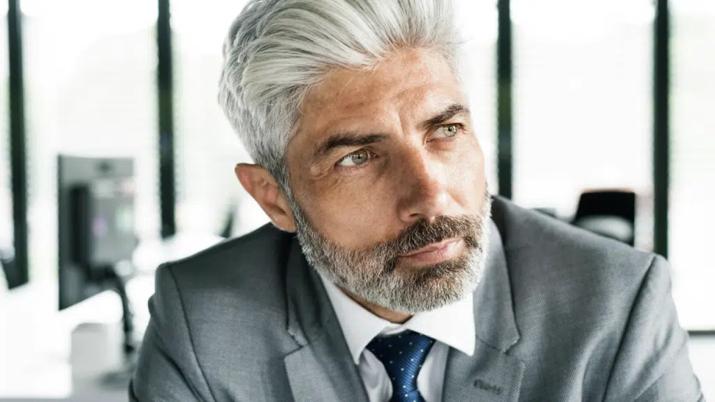 A mature man thinking deeply