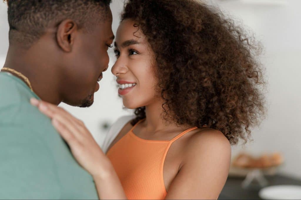 A man and woman facing each other