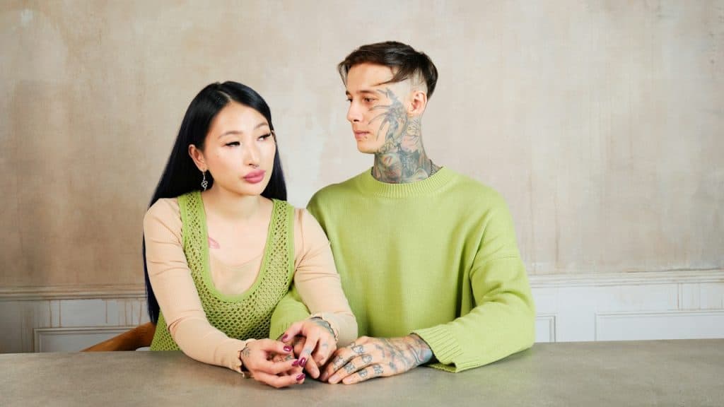 A man and woman sitting together at a table.