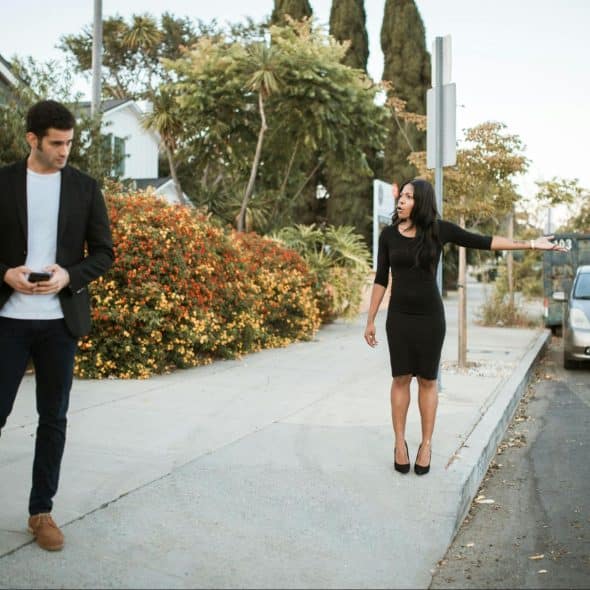 A man and woman arguing outside