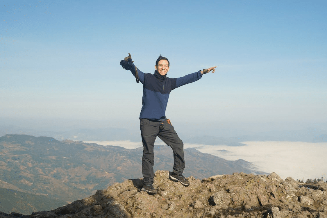 A man on top of a mountain
