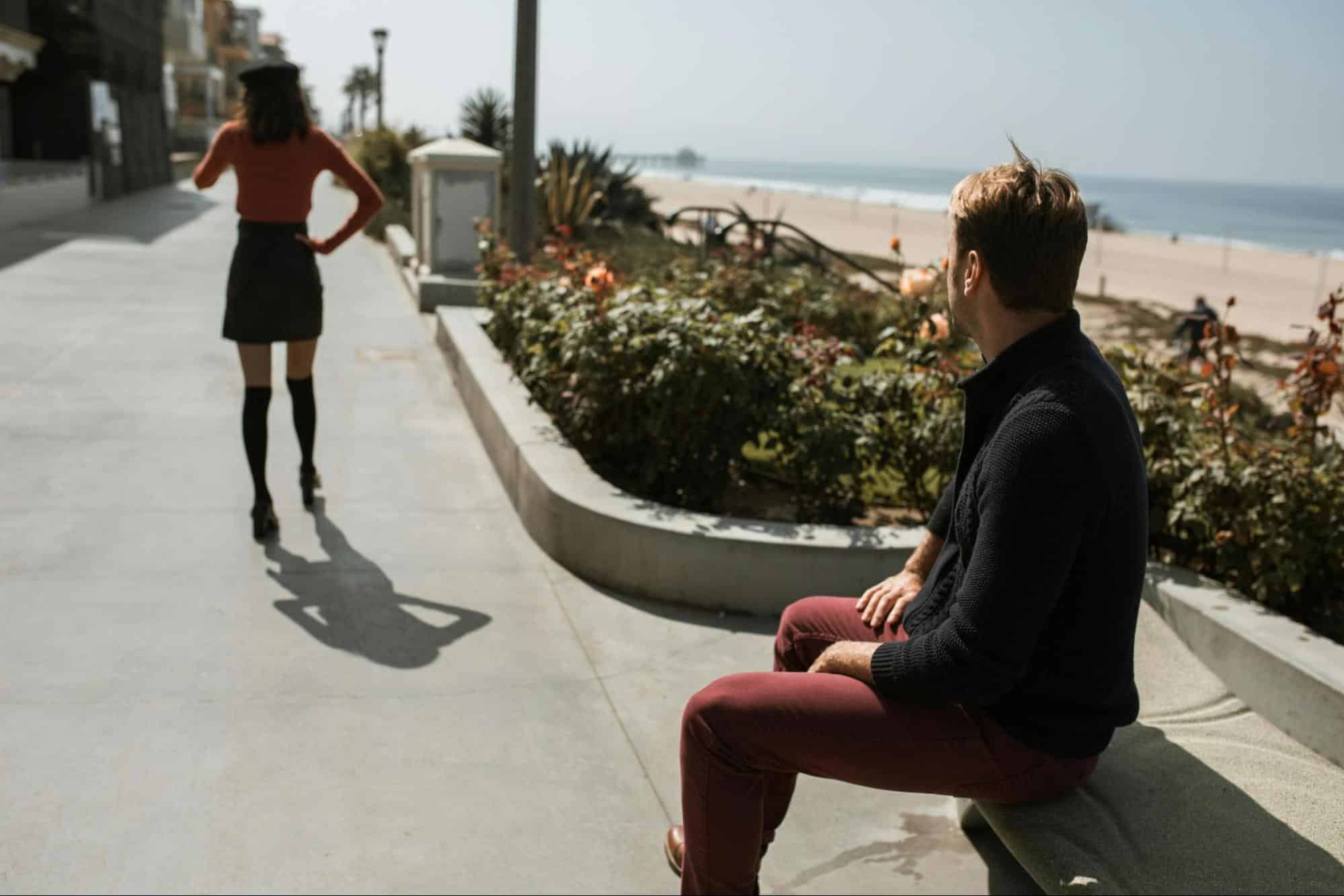 A woman walking away from a man