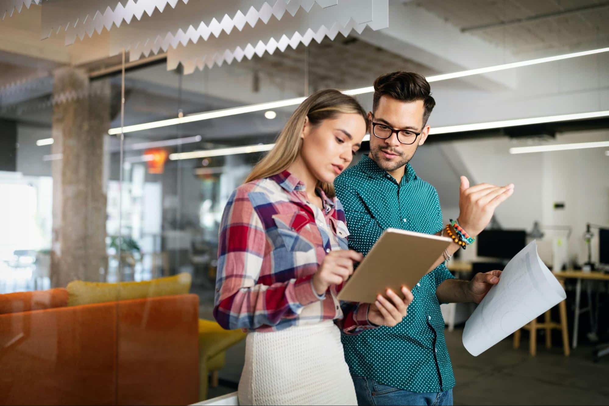 A man and woman talking about work
