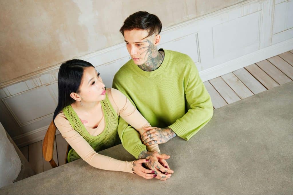 A man and woman holding hands
