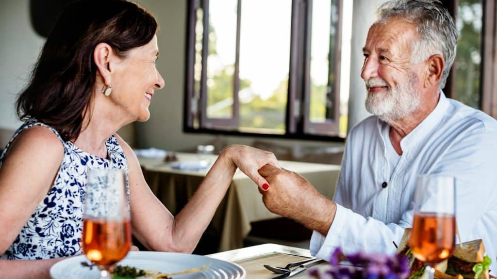 A mature man proposing to a woman.