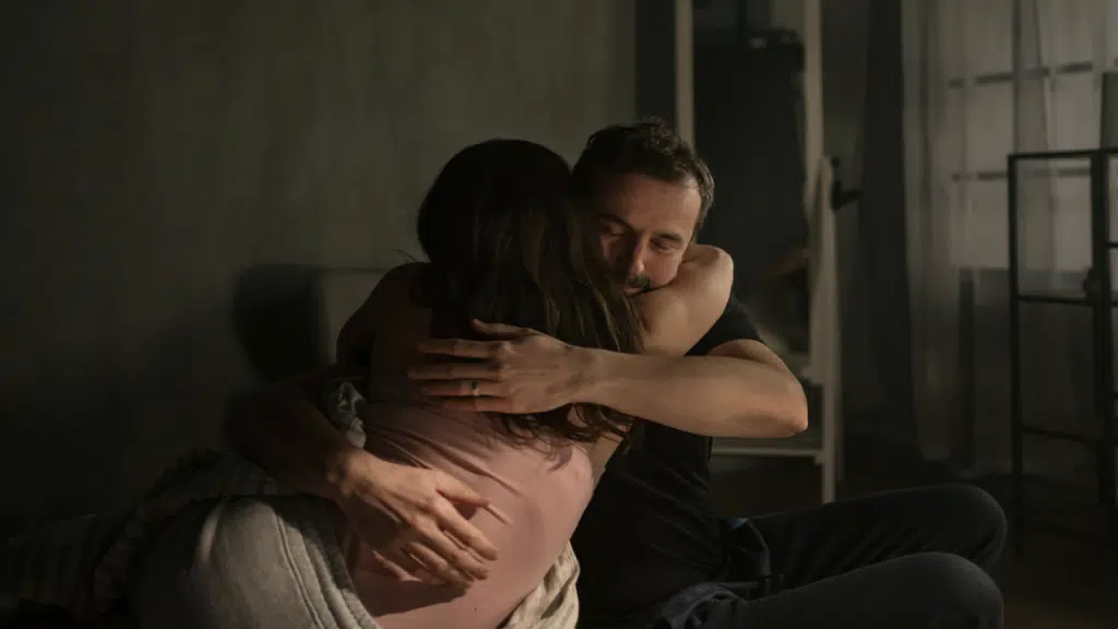 A couple giving each other a hug
