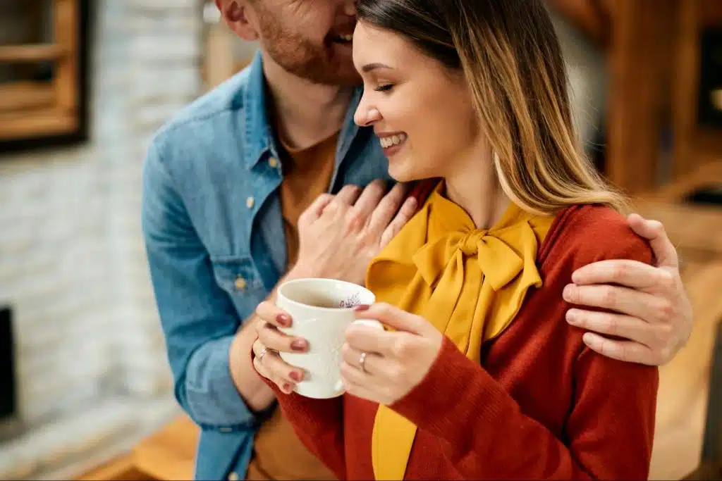 A man hugging a woman