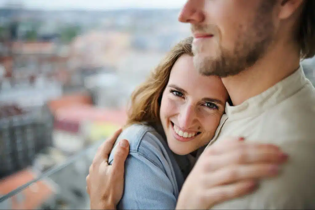 A man and woman hugging