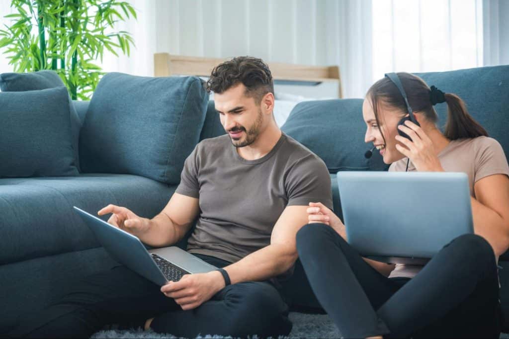 A man busy with work and a woman trying to have conversations with him